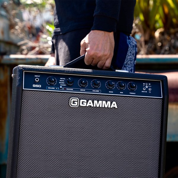 person carrying a GAMMA G50 Guitar Amplifier