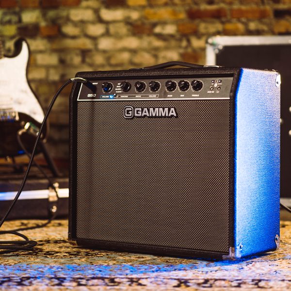 GAMMA G50 Guitar Amplifier with an electric guitar in the background