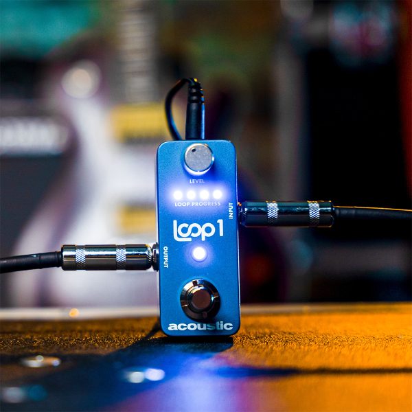 LOOP1 looper pedal in front electric guitar and amp