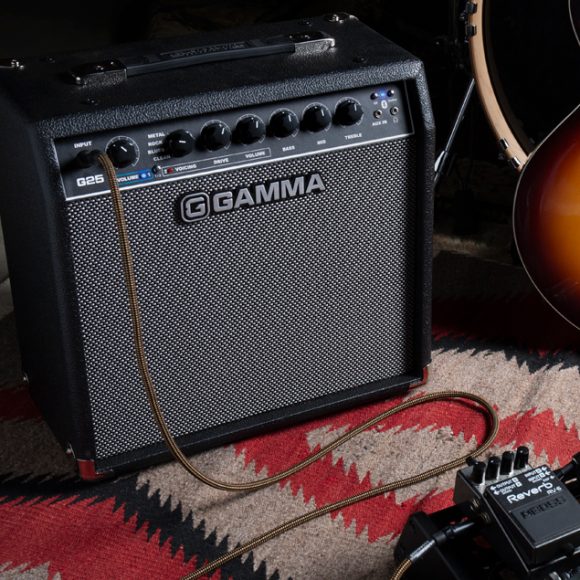 GAMMA G25 guitar amp on floor next to guitar and pedals