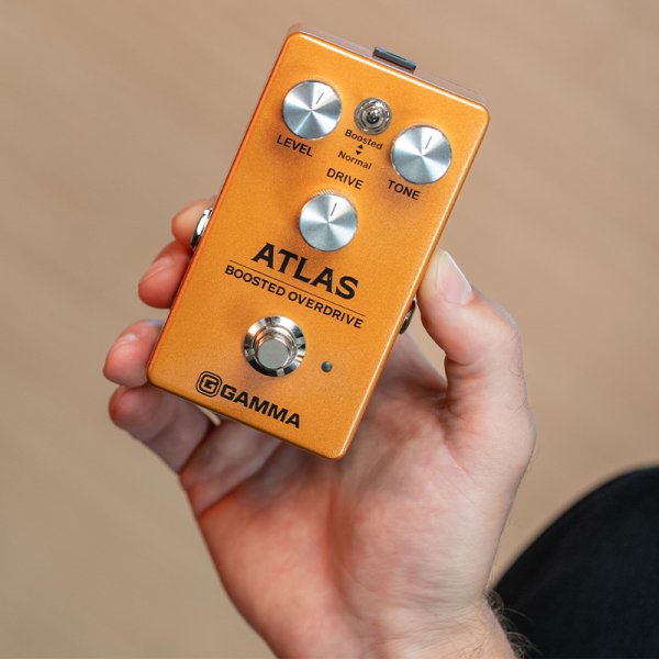 Gamma Atlas boosted overdrive pedal in hand.