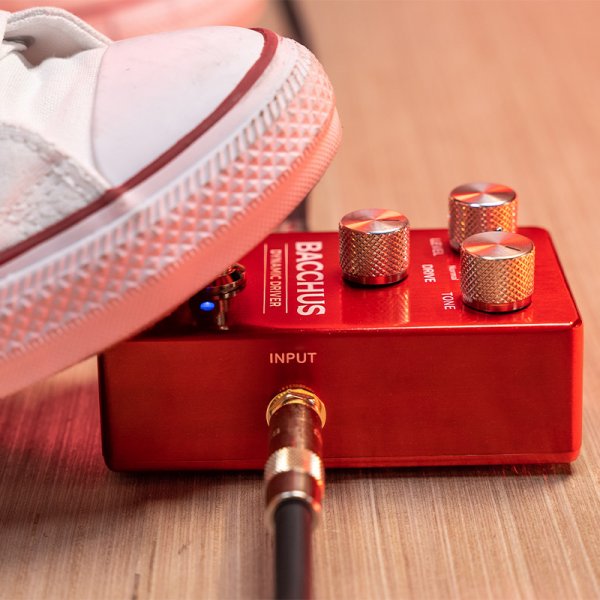 Gamma Bacchus dynamic drive pedal on the floor with foot stepped on.