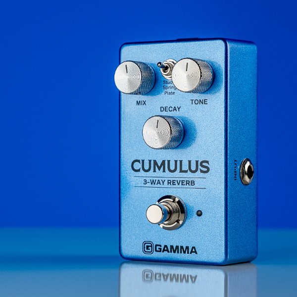 Gamma Cumulus 3-way reverb pedal in blue space standing left on the table.