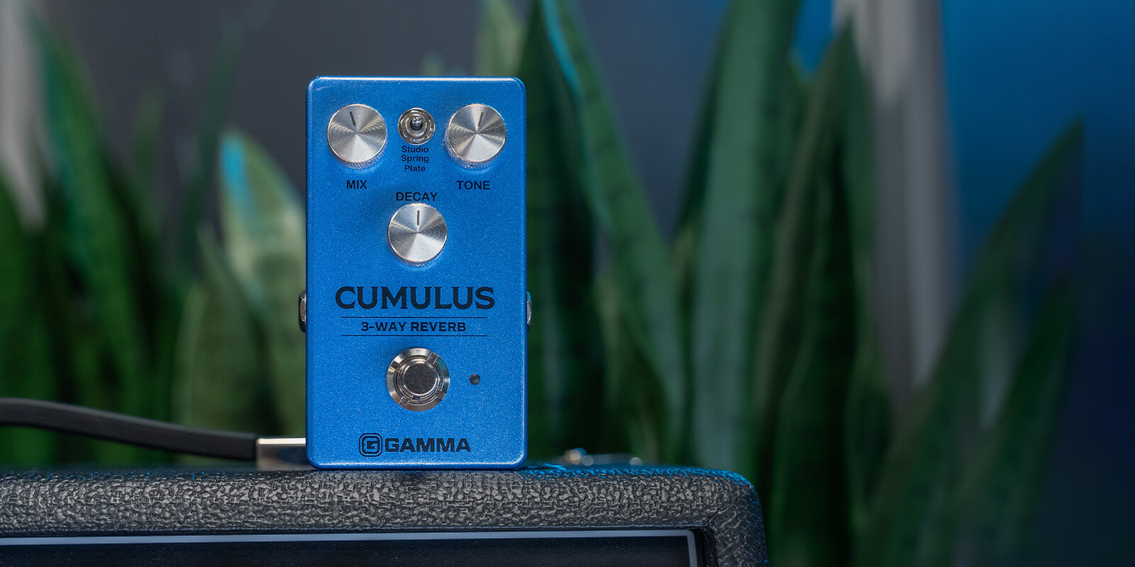 Gamma Cumulus 3-way reverb pedal standing on top of amplifier.