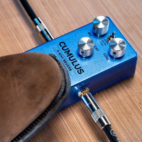 Gamma Cumulus 3-way reverb pedal on the ground with a foot stepped on.