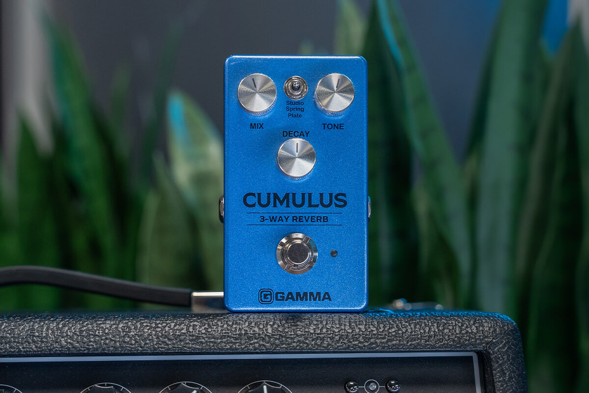 Gamma Cumulus 3-way reverb pedal standing on top of amplifier close up.