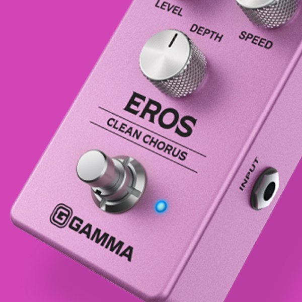 Gamma Eros clean chorus pedal switch close up on pink background.