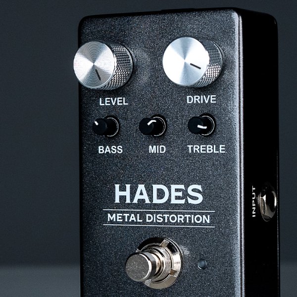 Gamma Hades metal distortion pedal in dark space standing left on the table close up.