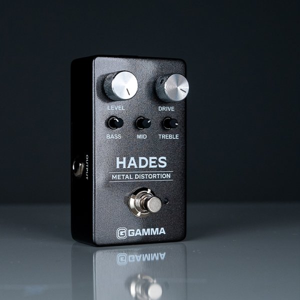 Gamma Hades metal distortion pedal in dark space standing right on the table.