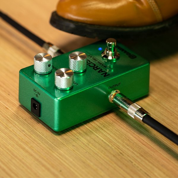 Gamma Narcissus warm delay pedal on the floor with a foot.